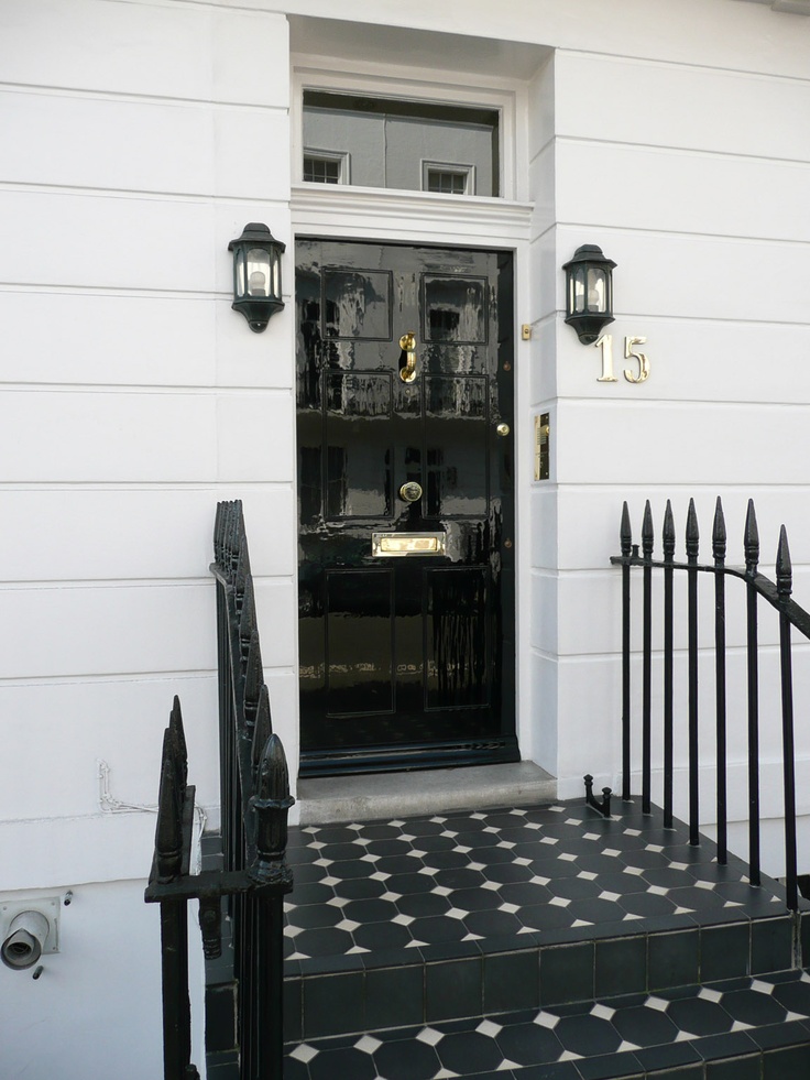 Black door, lanterns, tile